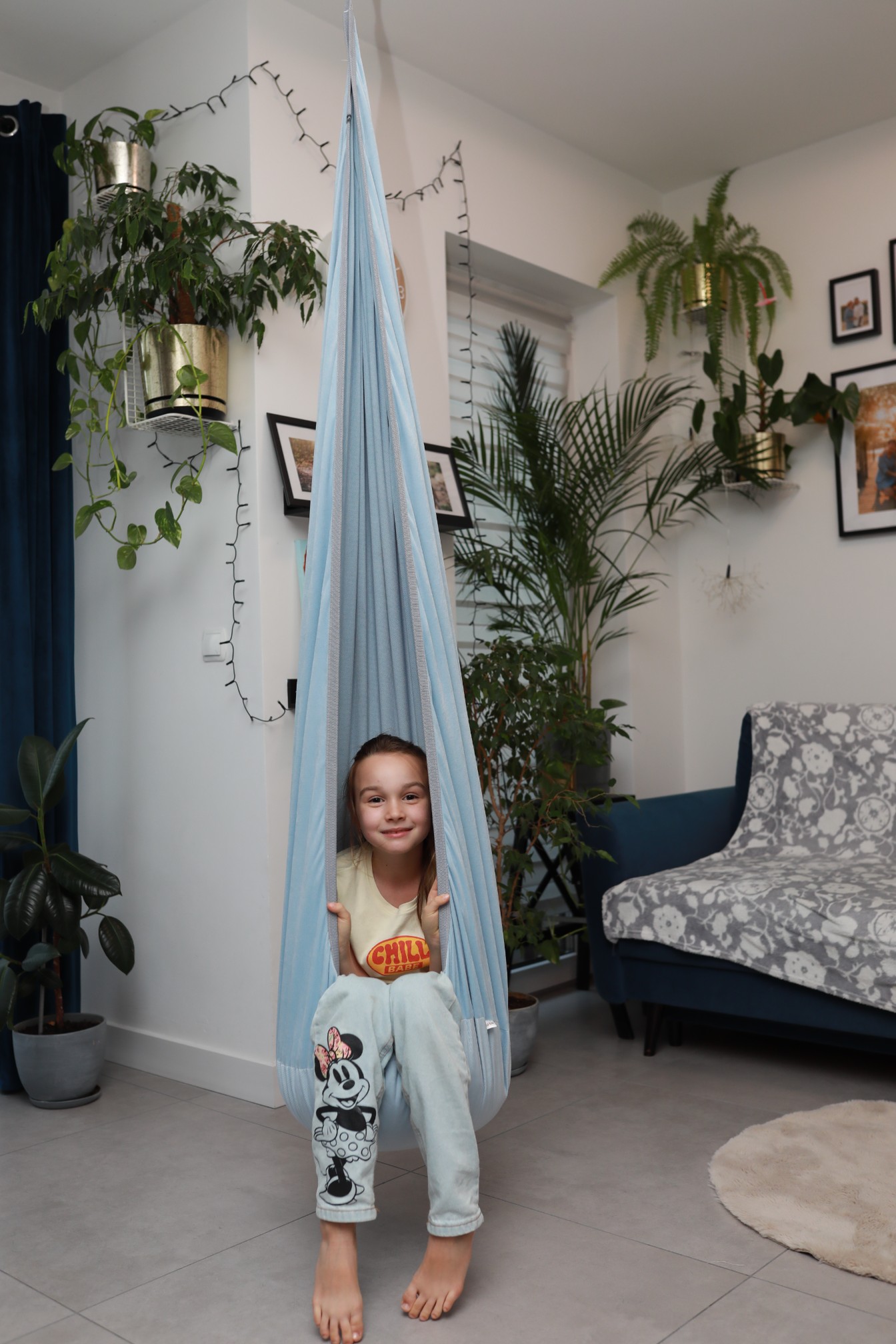 The hanging chair installs effortlessly onto ceiling hooks or indoor gym structures.